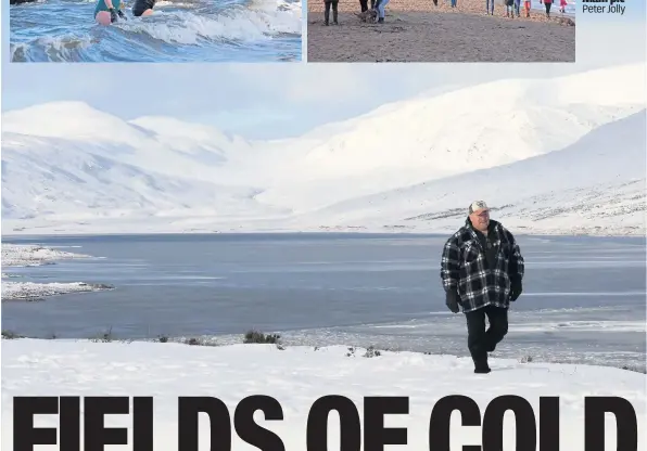  ??  ?? WINTER WONDER
A man enjoys a walk by Loch Glascarnoc­h, below. Left, swimmers and walkers on beach in Portobello, Edinburgh. Main pic Peter Jolly