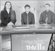  ?? JONI WILSON ?? Ashley Guess (from left), Jacob Truman and Jonathan Brinkley sit at the Channel 11 news desk in Little Rock. The Gentry students took second place in a social media campaign to promote career and technical education on April 17.