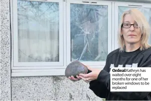  ??  ?? Ordeal Kathryn has waited over eight months for one of her broken windows to be replaced