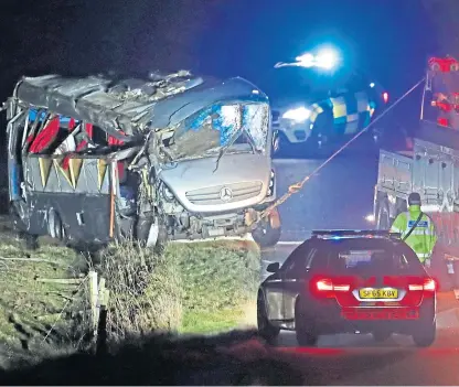  ?? Picture: PA. ?? The minibus was pulled out of a field on the A6089, between Carfraemil­l and Gordon.