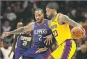  ?? Robert Gauthier Los Angeles Times ?? LeBRON JAMES and Kawhi Leonard could have access to personal trainers and massage therapists.