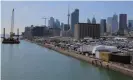  ??  ?? The downtown skyline and CN Tower are seen past the eastern waterfront area in the Port Lands district of Toronto. Photograph: Chris Helgren/Reuters