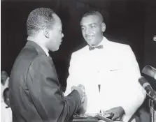  ??  ?? Horace Tate with Martin Luther King Jr. at a meeting of the Georgia Teachers and Education Associatio­n, 1967