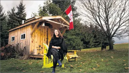  ?? CP PHOTO ?? Bryna Rabishaw poses for a photograph in front of her late husband Kevin’s sugar shack, which he made homemade maple syrup in at their home in Sharon, Ont. Despite having surgery to remove a large tumour on his pancreas, followed by rounds of...