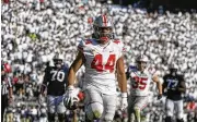  ?? BARRY REEGER / ASSOCIATED PRESS ?? End J.T. Tuimoloau led Ohio State’s defensive line last season with 10.5 tackles for loss as a sophomore, living up to his No. 4 ranking in the class of 2021. “He can play at a high level,” line coach Larry Johnson said. “We’ve seen him do that.”