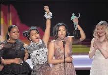 ?? CHRIS PIZZELLO/INVISION ?? From left, Octavia Spencer, Janelle Monae, Traji P. Henson and Kiersten Dunst accept the award for outstandin­g performanc­e by a cast in a motion picture for “Hidden Figures” at the SAG awards Sunday.
