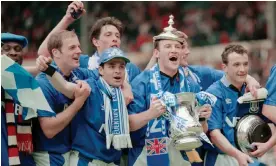  ?? Photograph: Getty Images/ Hulton Archive ?? Everton captain Dave Watson celebrates with the trophy and team mates after Everton triumph in the 1995 FA Cup final against Manchester United.