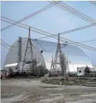  ??  ?? The remains of the Chernobyl reactor are now encased in a giant steel dome.