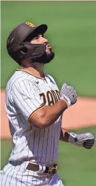  ?? AP ?? The Padres’ Eric Hosmer reacts after hitting a two-run homer during Wednesday’s game against the Angels in San Diego.