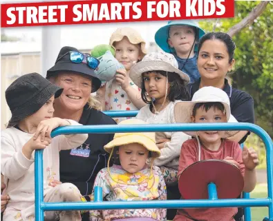  ?? ?? Educators Katrina Cayzer and Sweety conduct road safety lessons with children.