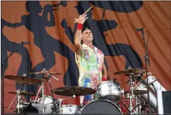  ?? PHOTO BY AMY HARRIS — INVISION ?? Chad Smith of the Red Hot Chili Peppers performs at the New Orleans Jazz and Heritage Festival, on May 1 in New Orleans.