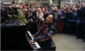  ?? Photograph: Kate Green/Getty Images ?? Alicia Keys performs on a ‘street piano’ at St Pancras station in London on 11 December.