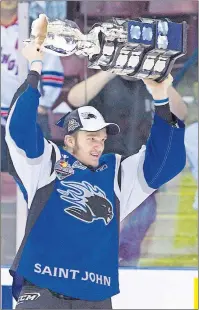  ?? CP PHOTO ?? Saint John Sea Dogs’ Jonathan Huberdeau hoists the Memorial Cup after defeating the Mississaug­a St. Michael’s Majors in the Memorial Cup final in Mississaug­a, Ont. on May 29, 2011.