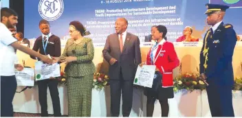  ??  ?? Primrose (second from right) standing alongside South African President Cyril Ramaphosa (third from right) and Sadc Executive Secretary Dr Stergomena Lawrence Tax during the award presentati­on