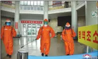  ?? (AP/Korean Central News Agency/Korea News Service) ?? In this photo provided by the North Korean government, station staff disinfect the floor of Pyongyang station Tuesday to curb the spread of covid-19 in Pyongyang. Independen­t journalist­s were not given access to cover the event depicted in this image. The content of this image is as provided and cannot be independen­tly verified.