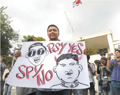  ??  ?? Malaysia’s UMNO Youth members gather to protest against the killing of Kim Jong Nam outside North Korean Embassy in Kuala Lumpur on Thursday. (AP)