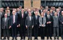  ?? PICTURE: AP ?? Foreign ministers and diplomats gather around French President Francois Hollande (front row, fourth from left) at the Paris conference which pushed for renewed peace talks that would lead to a Palestinia­n state.