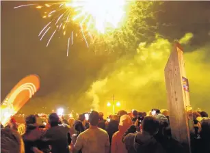  ?? PHOTO: GUY WILLIAMS ?? Big bangers . . . A smallertha­nusual crowd saw in the new year on Queenstown’s waterfront, enjoying a 10minute fireworks display launched from barges in Queenstown Bay.