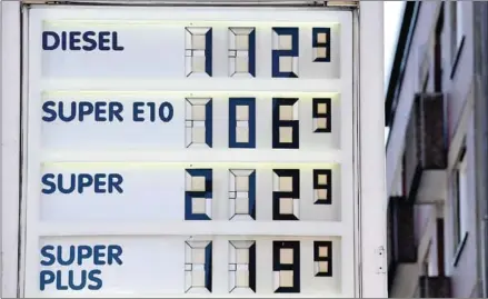  ?? AFP ?? A board with prices of gasoline and diesel at a Shell petrol station in Essen, western Germany.
