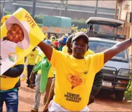  ?? ABUBAKER LUBOWA / REUTERS ?? Supporters of Yoweri Museveni celebrate the victory of Uganda’s incumbent president in the election in Kampala, Uganda, on Jan 16.