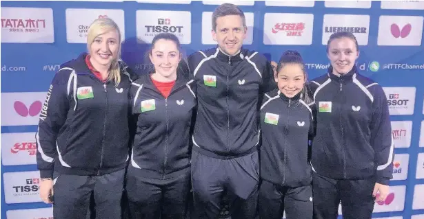  ??  ?? Team coach Stephen Jenkins pictured with the Welsh players at the recent world team championsh­ips in Sweden