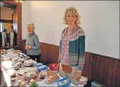  ?? 01_B28dougari­e09 ?? The new gamekeeper’s wife Suzi Ahlheid helps behind baking stall.