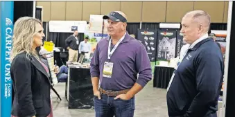  ?? [NATE BILLINGS/ THE OKLAHOMAN] ?? From left, Robin Slater with CenterPoin­t Energy Inc., Jay London with Jay London Homes LLC, and James Ward with Trinity Brick Sales talk during the OK Building Summit & Expo at the Cox Convention Center.