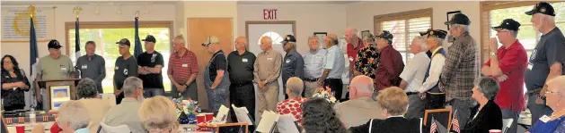  ??  ?? The line of Vietnam War veterans is impressive as they are called to the front by the Trammels Trace DAR to receive recognitio­n for their service. The event was part of the U.S. 50th Anniversar­y Commemorat­ion of the Vietnam War.