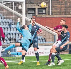  ??  ?? Jamie Macdonald under pressure as Arbroath push for a win