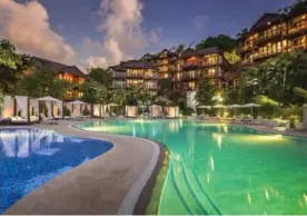  ?? ROBERT RECK/COURTESY OF CAPELLA MARIGOT BAY ?? Do you know what "back to school" rhymes with? "Time for pool!" Make this fall one to remember with a trip out to St. Lucia.
