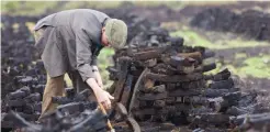  ?? ?? Keeping the home fires burning: A turf cutter at work