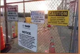  ?? ?? A gate at the entrance to the former Ciba Geigy chemical plant is filled with warnings Jan. 24 regarding the contaminat­ed area, which is on the Superfund list of the nation’s worst toxic waste sites.