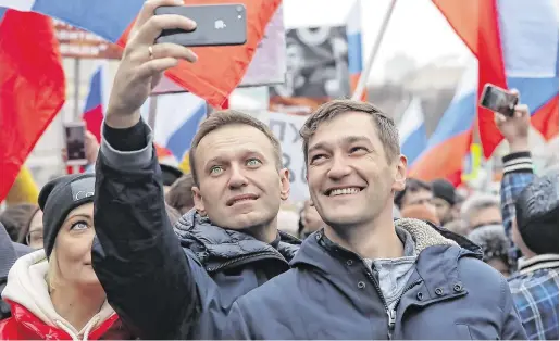  ?? PHOTO: REUTERS/MAXIM SHEMETOV ?? Critic: Russian opposition leader Alexei Navalny (left) and his brother Oleg at a rally in 2019.