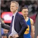  ?? TONY DEJAK/ASSOCIATED PRESS ?? Golden State head coach Steve Kerr, left, is hoping playing at home in Game 7 on Sunday will help his team.