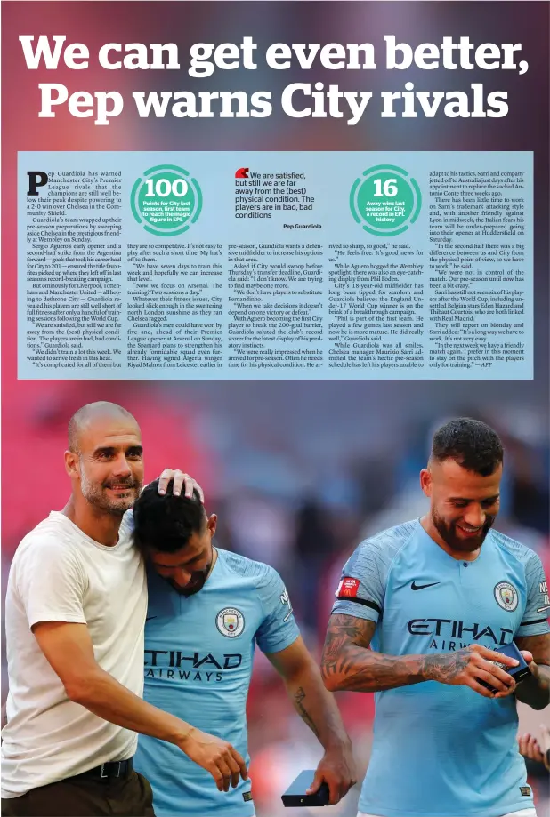  ?? — Reuters ?? Manchester City manager Pep Guardiola celebrates winning the Community Shield with striker Sergio Aguero and defender Nicolas Otamendi.