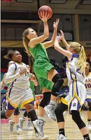  ??  ?? Buford’s Blair Wallis shoots over Villa Rica’s Marley Couch during Buford’s 67-59 win in the AAAAA girls state final Friday in Macon. Buford also swept both titles in 2017.