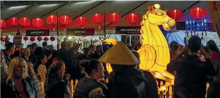  ?? PHOTO: STACY SQUIRES/STUFF ?? Food stalls in Cathedral Square drew in large crowds for the Chinese Lantern Festival in Christchur­ch.