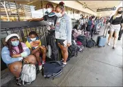  ?? AL SEIB/LOS ANGELES TIMES/TNS ?? Passengers wait for a flight home to Chicago from Los Angeles Internatio­nal Airport in 2021. One expert expects the industry to have a tough time until at least summer 2023.