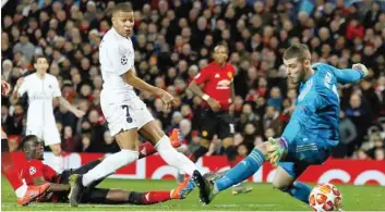  ?? — Reuters ?? Paris St Germain’s Kylian Mbappe scores their second goal against Manchester United in the Champions League Round of 16 First Leg at Old Trafford, Manchester.