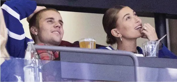  ?? CHRIS YOUNG/THE CANADIAN PRESS ?? Canadian pop star Justin Bieber and his wife, model Hailey Baldwin, attend a Leafs game in Toronto in November. Lawyers say there are still options for couples like Bieber and Baldwin, who didn’t sign a pre-nuptial agreement — a post-nup can be signed before or after a wedding that can be a “security blanket” or help safeguard their wealth.