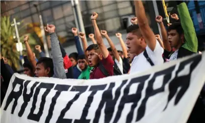  ?? Photograph: Edgard Garrido/Reuters ?? Students participat­e in a march in Mexico City on 26 February to mark the 65th month since the disappeara­nce of the 43 missing Ayotzinapa College students.