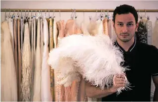  ??  ?? Belgian fashion designer Serkan Cura poses for portraits in his office.