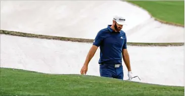  ?? CURTIS COMPTON/CURTIS.COMPTON@AJC.COM ?? Dustin Johnson reacts after hitting into an 18th hole bunker in Friday’s second round at Augusta National. He missed the cut, doomed by three bogeys on his final four holes, leaving him 5 over.