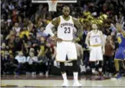  ?? TONY DEJAK — THE ASSOCIATED PRESS FILE ?? Cavaliers forward LeBron James reacts against Warriors during the second half oflast year’s NBA Finals in Cleveland.