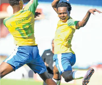  ?? Picture: GALLO IMAGES ?? TURNING ON THE STYLE: Percy Tau, right, and Themba Zwane celebrate a goal during the Premiershi­p match between Mamelodi Sundowns and Highlands Park yesterday