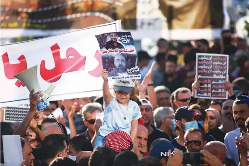  ?? (Flash90) ?? PALESTINIA­NS IN Ramallah attend a protest last week over the death of human rights activist Nizar Banat.