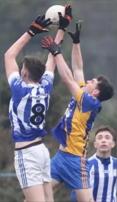  ??  ?? Good Counsel midfielder Andy Walsh takes to the air.