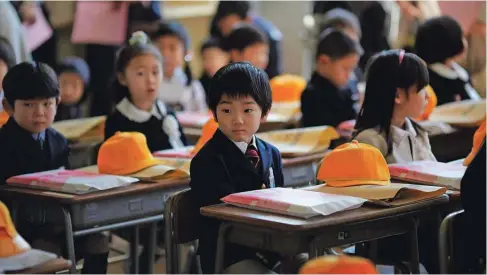  ?? Foto Reuters ?? Japonski otroci so že pred pandemijo vedeli, kaj pomeni biti tiho.