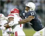  ?? BARRY REEGER — THE ASSOCIATED PRESS ?? In this file photo, Penn State linebacker Micah Parsons (11) tackles Rutgers tight end Johnathan Lewis (11) in the first quarter of an NCAA college football game, in State College, Pa. Parsons was selected to The Associated Press AllAmerica team, Monday.