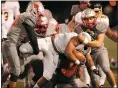  ?? TIM PHILLIS — FOR THE NEWS-HERALD ?? Mentor’s Jackson Paglio, right, tackles a Euclid runner during the teams’ game Oct. 25. Paglio has announced he will play football at Mount Union.